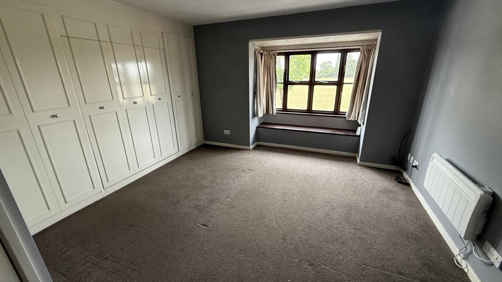 Lot: 144 - VACANT STUDIO FLAT FOR INVESTMENT - Internal image of studio living area with bed up